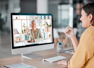 Benefits of Hiring a Virtual Coach Video call, computer and business women wave in offic