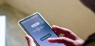 Best Free Voice Changers with Voice Cloning Capabilities for Realistic Sounding Voices Man using mobile applications for cloning his voice
