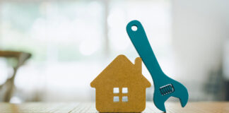 Predator Stump Grinder: An Essential Tool for Property Maintenance Model house and wrench, home services.