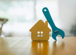 Model house and wrench, home services.
