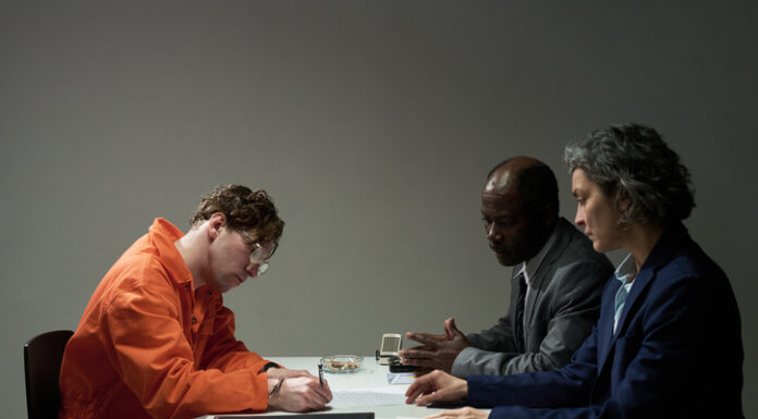 The Benefits of Hiring a Local Criminal Defense Attorney Conducting Important Legal Consultation in Office Setting