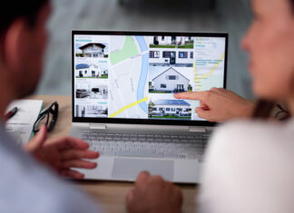 Family Searching Real Estate Online On Laptop