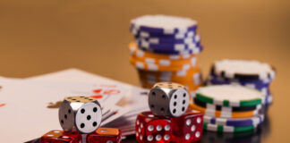 Roll the Dice Right: Finding Europe’s Top Casinos for Fair Play and Fast Payouts set of playing card with dices on reflective table