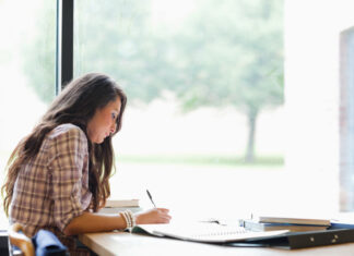 Tips for Balancing Work and Play for Academic Success Gorgeous student studying in the library