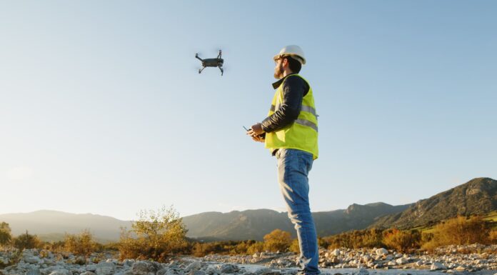When and Why Your Business Should Invest in Drone Technology Man flying drone