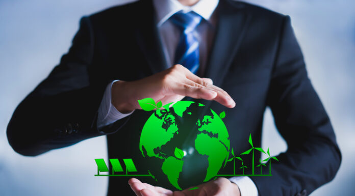 How Businesses Can Lead the Charge Toward a Greener Future Businessman with a green globe