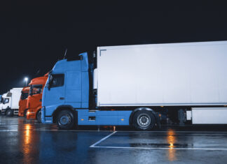 Line of Semi-Trucks with Cargo Trailer Drives Standing on the Overnight Parking Place