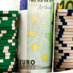 Poker casino chips and money close up