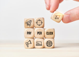 Know about PPC Management’s Future: Trends to Track in 2024 Person stacks wooden cubes from text and icons