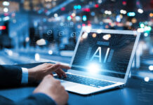 Why Vertical SaaS is the Launchpad for Emerging AI Companies Businessman using laptop with AI