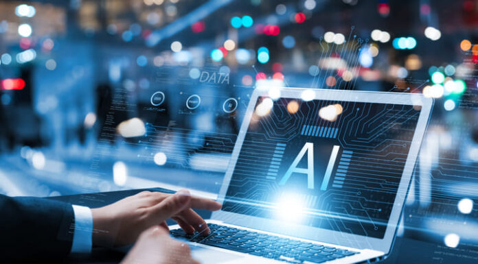 Businessman using laptop with AI