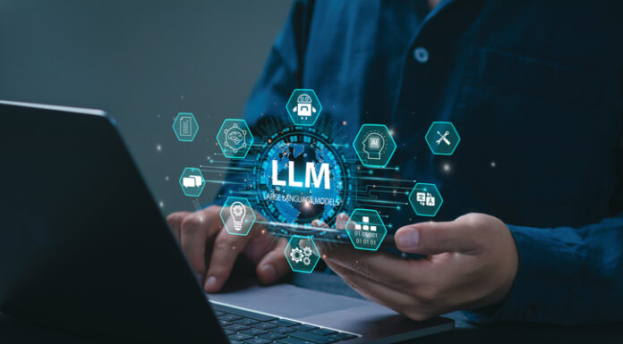 AI Large Language Model concept. Businessman holding a smartphone with LLM icons on virtual screen