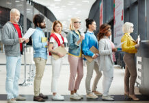 “Your Call is Important to Us”: The Business Psychology of Queuing Queue of people