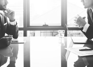 board members talking - black and white