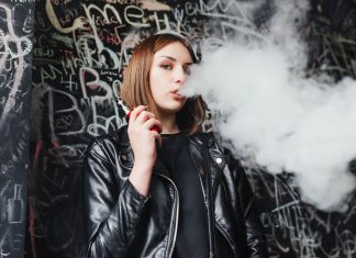 Woman using e-liquid vape