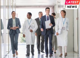 Scientists and business people walking in hallway