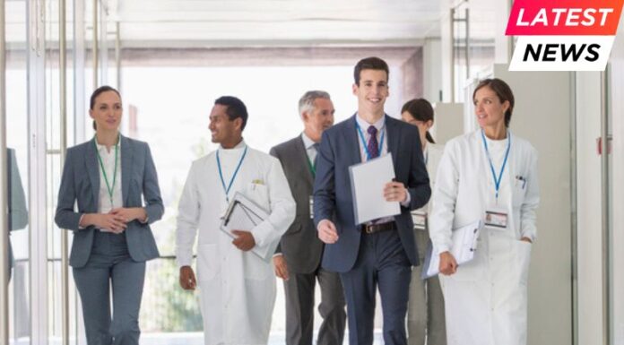 HEC Paris Launches €10 Million Mentorship Research Lab Scientists and business people walking in hallway