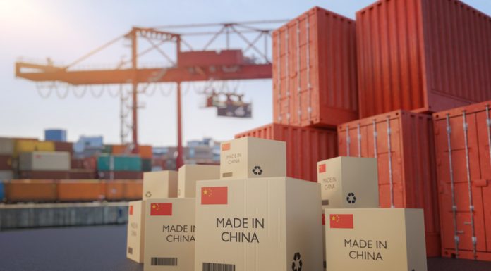 8 Key Steps for Companies to Import from China Many chinese cargo containers and cardboard boxes. Importing goods from China