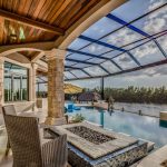 Customizing Swimming Pool Enclosures: Designs to Fit Your Space and Needs Large pool area with net enclosure