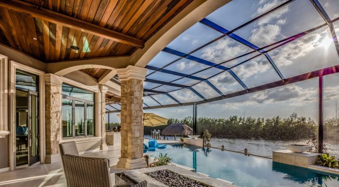 Customizing Swimming Pool Enclosures: Designs to Fit Your Space and Needs Large pool area with net enclosure