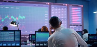 Prop Trading Companies: Where Dreams Meet Destiny Male trader using computer to trade stocks