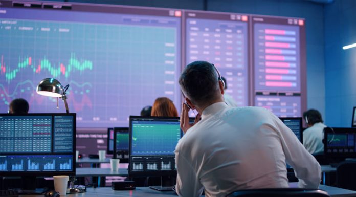 Prop Trading Companies: Where Dreams Meet Destiny Male trader using computer to trade stocks