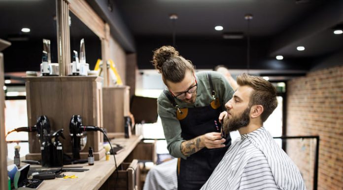 The Rise of Barbershops in Europe: A Growing Business Trend Client during beard shaving in barber shop
