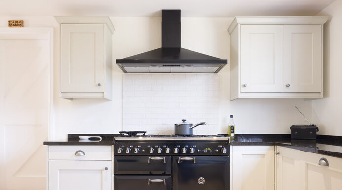 Modern modular kitchen interior, range cooker and chimney hood