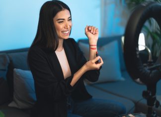 Influencer Marketing in 2025: The Good, The Bad, and The Unexpected Female makeup influencer vlogging online with smartphone cam and ring led from home