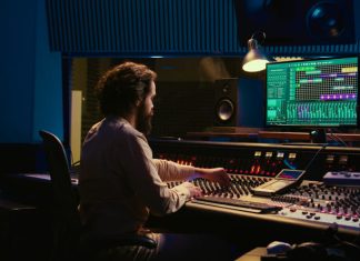 How to Build Your First Sonic Toolset Control room sound engineer editing music with sliders and knobs - Sonic Toolset