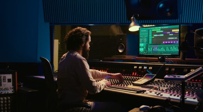 How to Build Your First Sonic Toolset Control room sound engineer editing music with sliders and knobs - Sonic Toolset