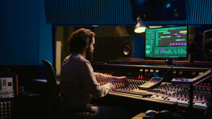 iStock-2148355953 (1) Control room sound engineer editing music with sliders and knobs - Sonic Toolset