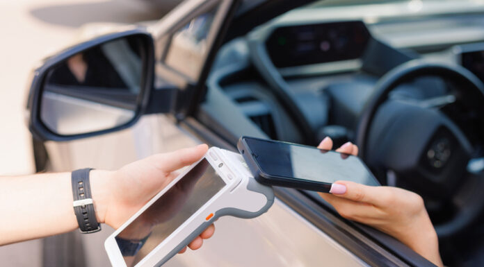 The Role of E-Challans in Promoting Safer Driving Habits in Bangalore girl driver makes NFC payment with her mobile phone, contactless payment method for services