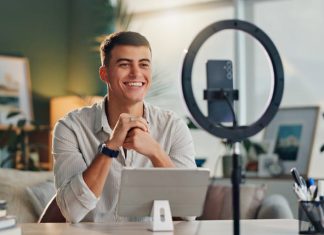 For Creators, the Creator Economy is Just Getting Started in 2025 content creator with smartphone for social media or online vlog and live streaming.