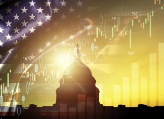 Inflation, Fed Policies, and Trump’s Economic Vision Silhouette of White House with united state of America flag and stock market chart for USA election president related with economy and investment