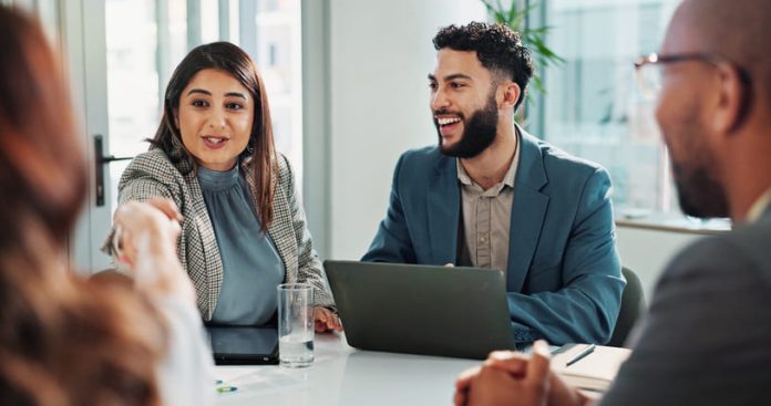 iStock-2186986119 (1) Business people and laptop with handshake in meeting