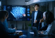 Reimagining Learning & Development in an AI-Powered Workplace In the Conference Room Chief Engineer Presents to a Board of Scientists New Revolutionary Approach for Developing Artificial Intelligence and Neural Networks