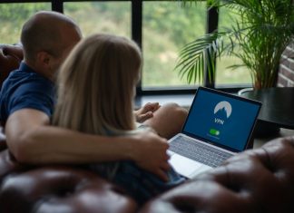 Couple using laptop with VPN on screen
