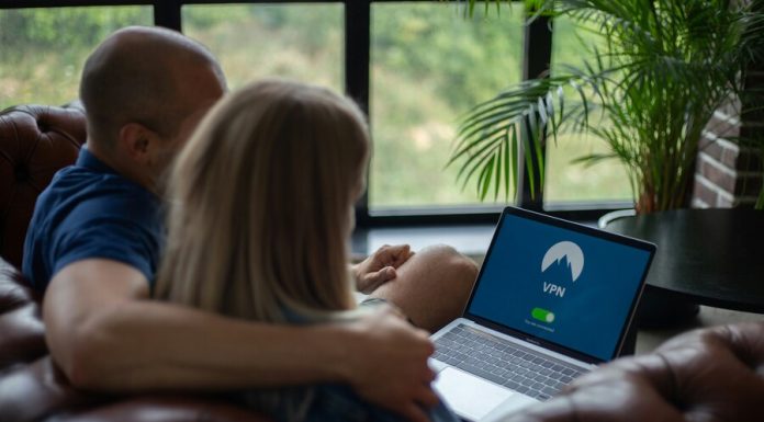 Cybersecurity Trends for 2025: The Predictions By IBM Couple using laptop with VPN on screen