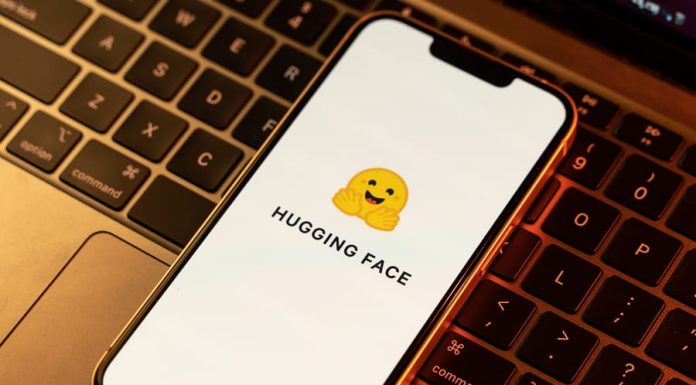 Hugging Face: Why Do Most Tech Companies in AI Collaborate with Hugging Face? Hugging face logo on phone screen