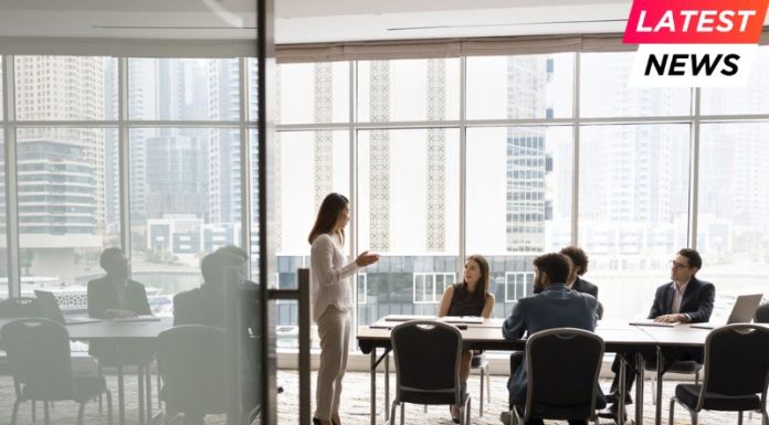 London Business School Launches Flexible Executive MBA Options in London and Dubai team talking at meeting table