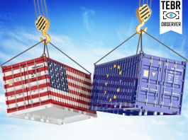 After Tariffs on Canada, Mexico, and China, Trump Looks Toward the EU cargo containers with USA and European Union flags hoisted by crane hooks on blue cloudy sky