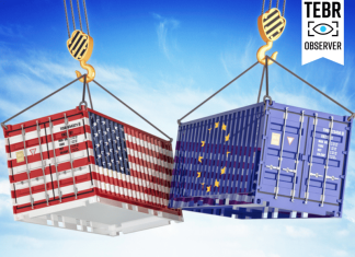 cargo containers with USA and European Union flags hoisted by crane hooks on blue cloudy sky