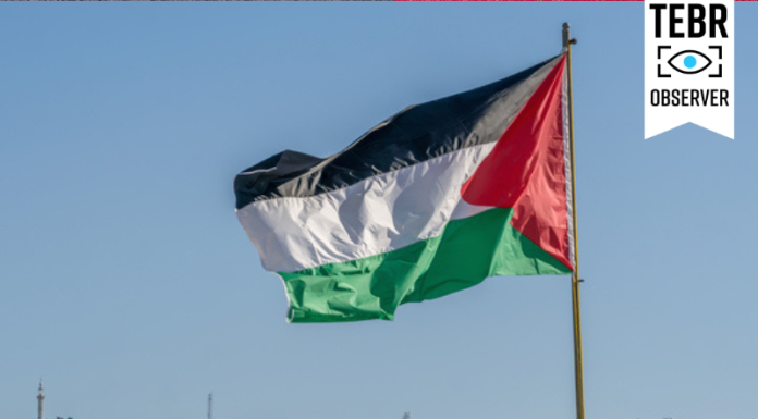 The large Palestinian flag is waiving above the city.