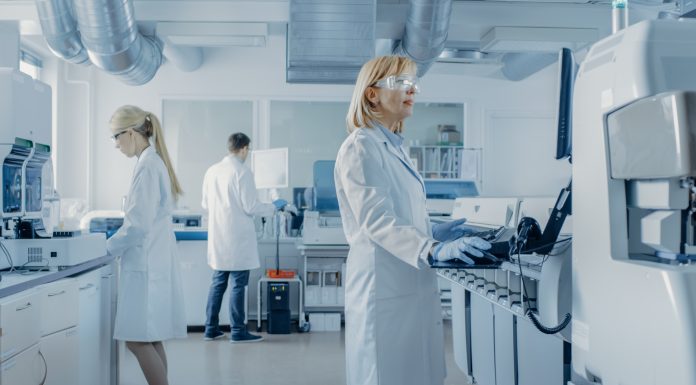 Team of Research Scientists Working On Computer, with Medical Equipment