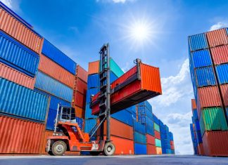 ontainer stacker crane lifting up stacking container box in yard, Container loading cargo freight in import and export business logistic company, Industry logistic and transportation