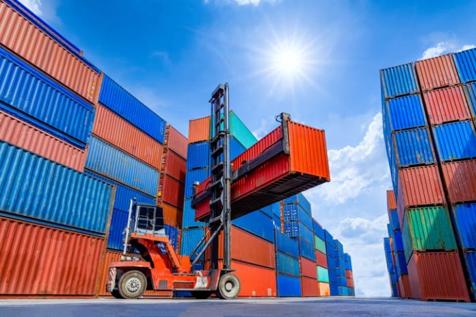 ontainer stacker crane lifting up stacking container box in yard, Container loading cargo freight in import and export business logistic company, Industry logistic and transportation