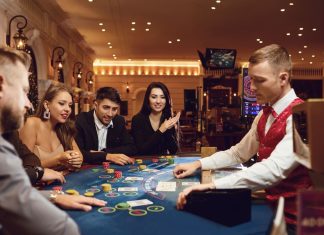eople gamble at a poker table in a casino