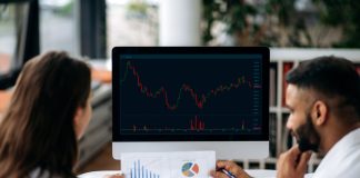 The Role of Data in Proprietary Trading Smart successful business colleagues in trading, sitting in modern office, looking at screen with stock market graphs, analyzing dynamics, developing a strategy,