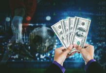 The Business of Betting: How Data-Driven Strategies Are Transforming Gambling Businessman hands holding money with footballer